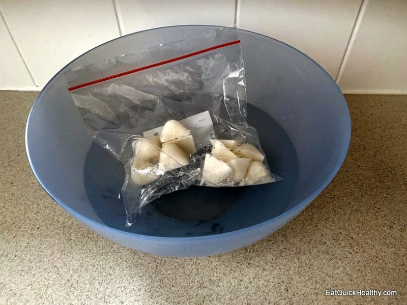 Defrosting coconut milk cubes in cold water