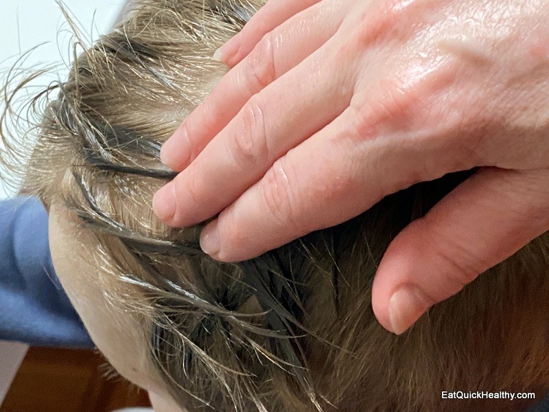 lice coconut oil rubbing into head