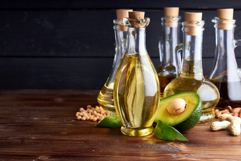 Useful vegetable oils in glass bottles.Almond oil Avocado oil, chickpea oil, linseed oil, peanut oil